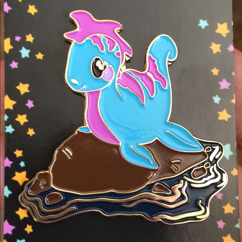 Soft enamel plesiosaur on a rock 2”
